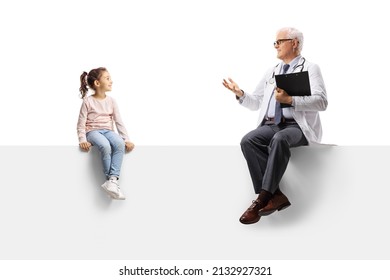 Doctor Sitting On A Blank Panel And Talking To A Little Girl Isolaated On White Background