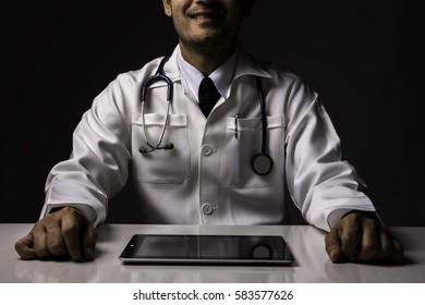 A Doctor Smile And Tablet On A Table , Dramatic Image