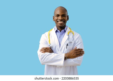 Doctor Smiling With Folded Arms Wearing Lab Coat Indoors Studio