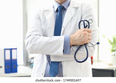 Doctor standing in office with stethoscope in his hand. Platform for online consultation with doctors. Family doctor appointment online. Pandemic disease prevention. Elucidation medical history - Shutterstock ID 1749001697