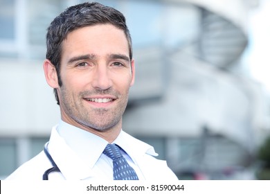 Doctor Standing Outside The Hospital Building