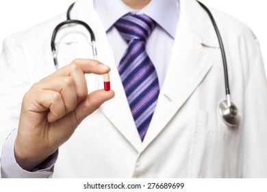 Doctor With Stethoscope Holding Pill