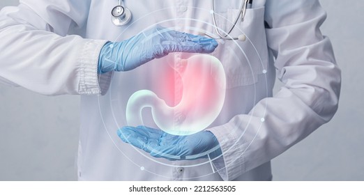 Doctor with stomach and different icons on virtual screen against grey background - Shutterstock ID 2212563505