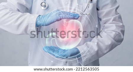 Doctor with stomach and different icons on virtual screen against grey background