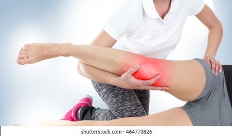 Doctor is stretching woman leg on physiotherapy session. - Powered by Shutterstock