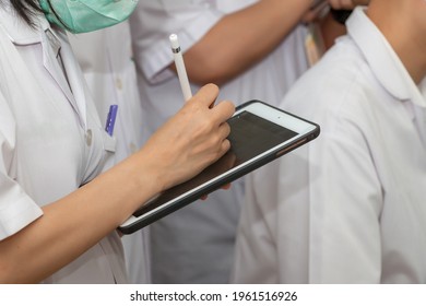 Doctor Student Use A Tablet To Study. Healthcare And Medical Education. Selective Focus