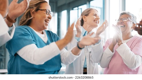 Doctor, support and applause in celebration for team unity, healthcare achievement or goal at the hospital. Group of medical professional clapping and celebrating teamwork, unity or victory at clinic - Shutterstock ID 2263208865
