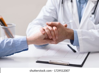 Doctor supporting senior patient after reading bad analysis results at clinic, close up - Powered by Shutterstock