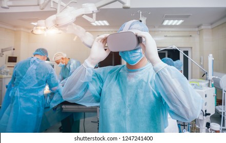 Doctor in a surgical room with virtual reality glasses on the background of the real operation. Modern technologies - Powered by Shutterstock