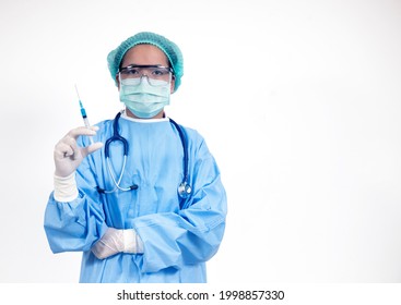 Doctor In Surgical Suite Holding Vaccine Covid-19 Syringe ,Coronavirus Or Covid-19 Outbreak Concept