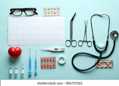 Doctor Table With Medical Items, Cardiogram And Pills, Top View