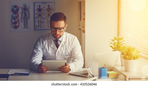 Doctor With Tablet Computer In Her Office