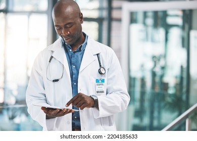 Doctor With Tablet, Happy Reading Social Media Post, Text Or Email From On Break At Hospital. Black Man In Healthcare Career, On Internet To Research Information On Medical Science And Technology