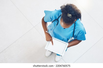 Doctor, Tablet And Healthcare Website With Blank Mockup Screen While Standing And Working In A Hospital From Above. Medical Insurance App, Nurse And 5g Network For Innovation In Health And Medicine