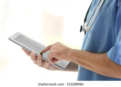Doctor with tablet at hospital