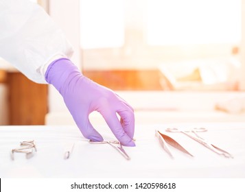 Doctor takes medical instruments from the table for the concept of transplantation of human organs and tissues, transplantology