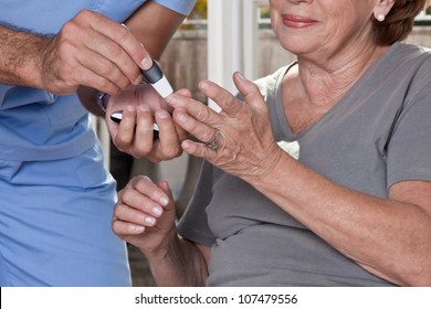 Doctor taking a blood sample from a female patient's.