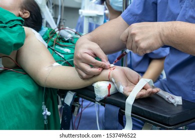 Doctor Taking Blood Sample From Patient In The Operating Room. Blood Drawing Sample For Blood Test The Health.