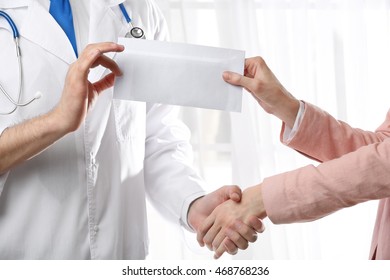 Doctor Taking Bribe From Woman Hand Closeup