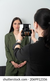 Doctor Taking Picture Of Female Patient Before Aesthetic Treatment On White Background With 3d Camera System