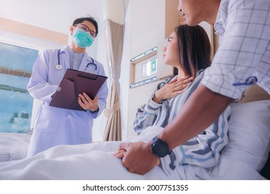 Doctor Talk To Woman Patient About Examining Result At Hospital, Family Health Care, Palliative Care, With Husband Holding Hand Of Patient At Hospital. Selected Focus