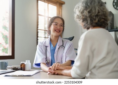 Doctor talking with elderly asian woman. Female primary care physician having conversation with older woman. Elderly Healthcare - Shutterstock ID 2253104309