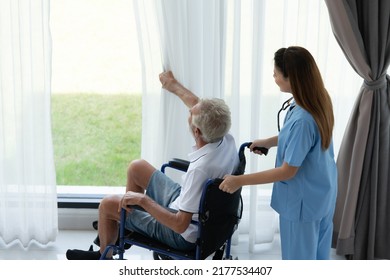 Doctor Talking To Elderly Patient With Symptoms Of Depression Look At Nature Outside The Window In A Special Patient Room.