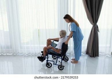 Doctor Talking To Elderly Patient With Symptoms Of Depression Look At Nature Outside The Window In A Special Patient Room.