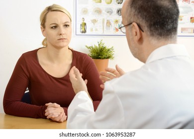 Doctor Talking To A Female Patient Shares A Bad Diagnosis