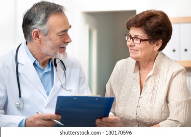 doctor talking to his female patient at office