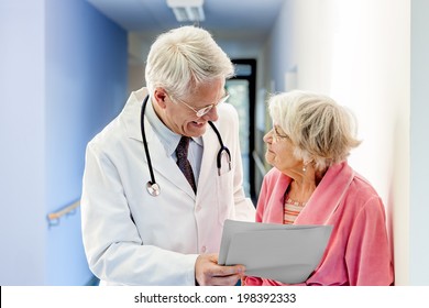 Doctor Talking To Old Woman About Good Results At The Hospital.