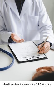 Doctor talking to patient and filling patient history, examination, treatment, medical and health concept.	 - Shutterstock ID 2341620073
