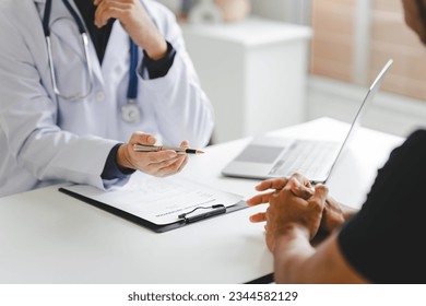Doctor talking to patient and filling patient history, examination, treatment, medical and health concept.	 - Shutterstock ID 2344582129