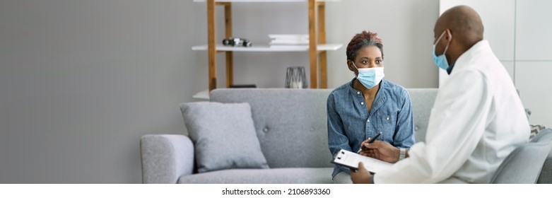 Doctor Talking To Patient In Medical Mask