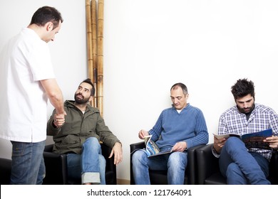 Doctor Talking To Patient In Waiting Room