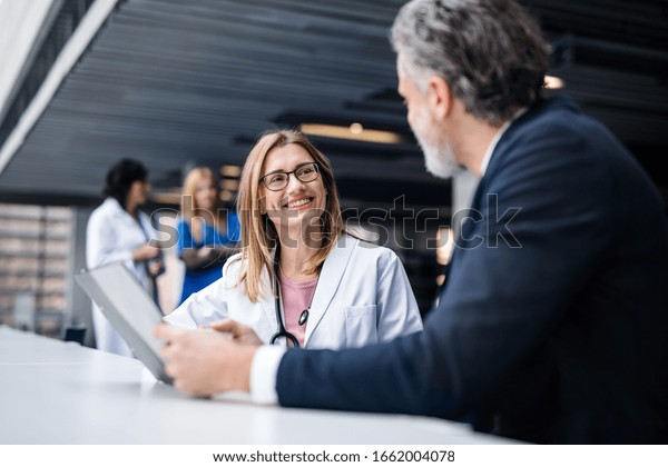Doctor\
talking to a pharmaceutical sales\
representative.