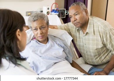 Doctor Talking To Senior Couple