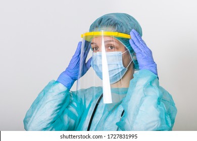 Doctor teaching how to wearing PPE suit for Coronavirus outbreak or Covid-19, Concept of Covid-19 quarantine. Doctor nurse wearing protection Suit for Fighting Covid-19 (Corona virus) - Powered by Shutterstock