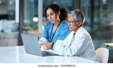 Doctor, team with healthcare and women with laptop, working together and digital hospital schedule or agenda. Technology, medical innovation and collaboration, partnership and cardiovascular surgeon - Powered by Shutterstock