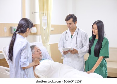 Doctor And Team Visit To Elderly Patient At Hospital Room. Healthcare And Medical Concept.