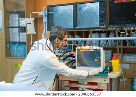 Doctor or technicians operating machine at operation theater