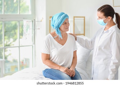 Doctor telling good news to mature woman after chemotherapy in clinic - Shutterstock ID 1946812855