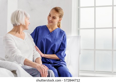 Doctor telling pensioner about her health state