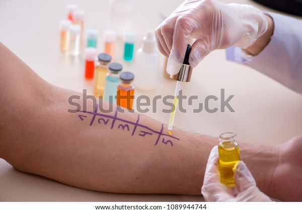 Doctor\
testing allergy reaction of patient in\
hospital