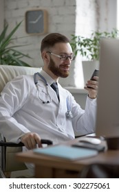 Doctor Texting On His Smartphone