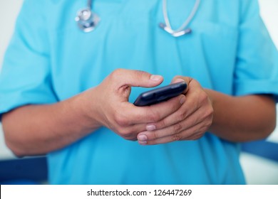 Doctor Texting On Mobile Phone