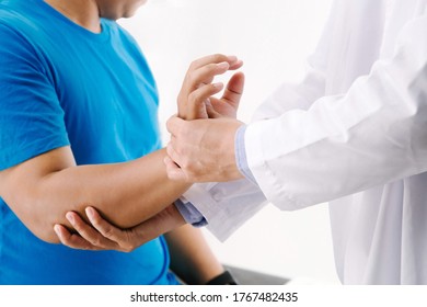 doctor therapist massage the patient's finger hand. pain trigger finger lock in clinic or hospital 