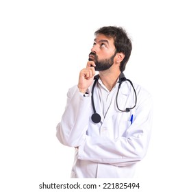 Doctor Thinking Over Isolated White Background