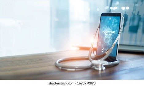 Doctor through the smartphone screen, Doctor online, Online medical communication with patient and analysis health on virtual interface, Online and medical consultation, Virtual hospital, Covid-19  - Powered by Shutterstock