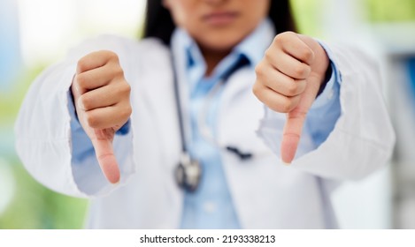 Doctor With Thumbs Down Hand Sign In Healthcare Hospital Or Lab For Fail, Poor Health Insurance Or Death Statistics. Zoom Of Unhappy, Bad Loss Or Loser Hands Emoji Icon Of A Healthcare Professional